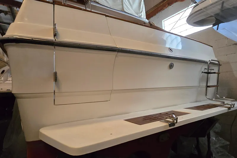 Slide: The Image of 1987 Sea Ray 340 Sedan Bridge boat stern view in storage. - 39