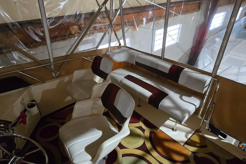 Slide: The Image of Interior seating area of a 1987 Sea Ray 340 Sedan Bridge boat. - 4