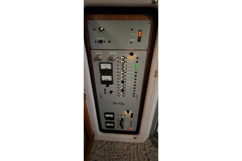 Slide: The Image of 1987 Sea Ray 340 Sedan Bridge control panel with gauges and switches. - 41