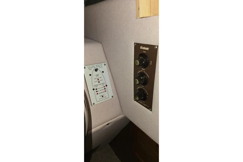 Slide: The Image of Control panel on a 1987 Sea Ray 340 Sedan Bridge boat interior. - 42