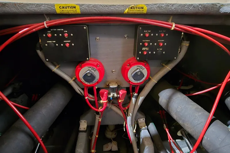 Slide: The Image of Electrical panel of a 1987 Sea Ray 340 Sedan Bridge with wiring and controls. - 45