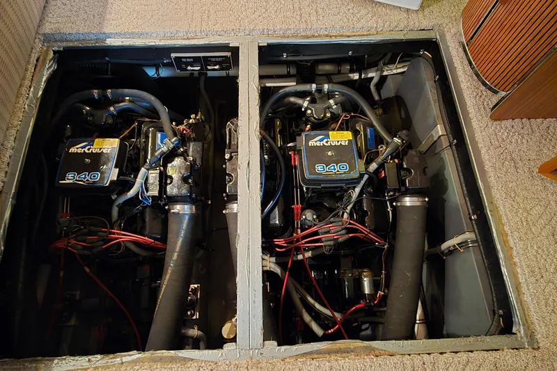 Slide: The Image of Engine compartment of a 1987 Sea Ray 340 Sedan Bridge with twin MerCruiser 340 engines. - 47