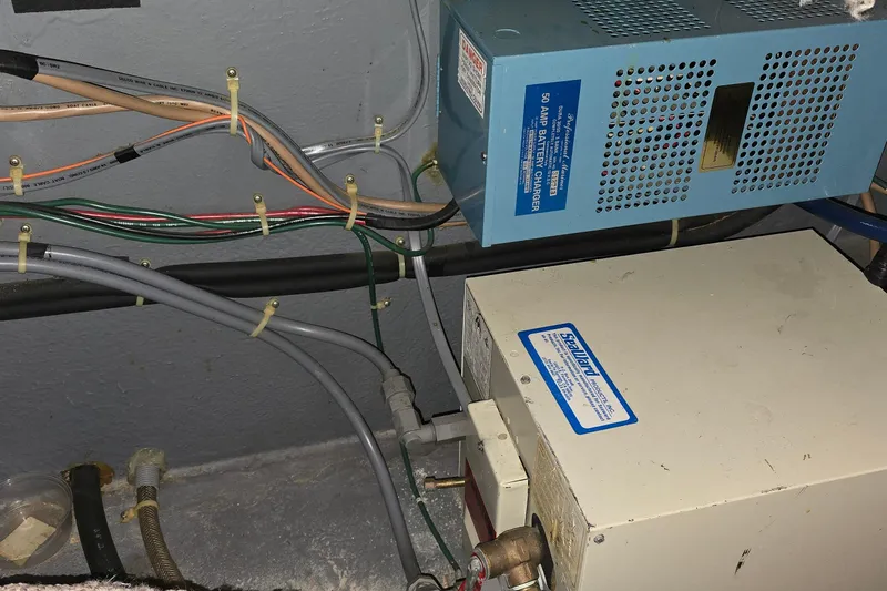 Slide: The Image of Electrical wiring and battery charger in a 1987 Sea Ray 340 Sedan Bridge boat. - 50