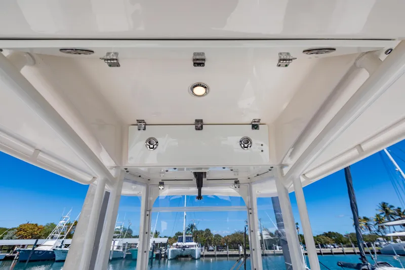 Slide: The Image of 2023 Cobia 240 Center Console boat interior with overhead storage and lighting. - 19