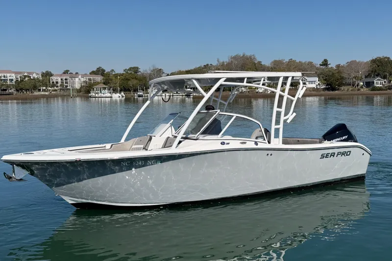 Slide: The Image of 2024 Sea Pro 240 Dual Console boat on calm water, showcasing sleek design and modern features. - 10