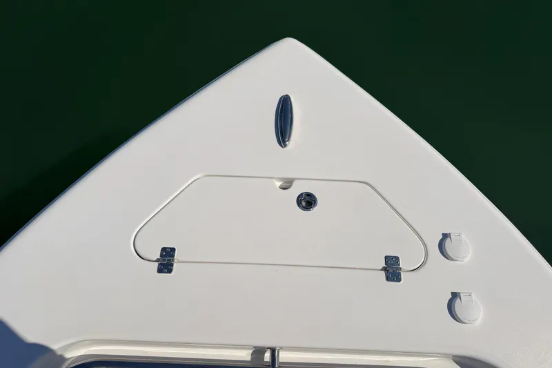 Slide: The Image of Bow of 2024 Sea Pro 240 Dual Console boat with storage hatch and fittings. - 19