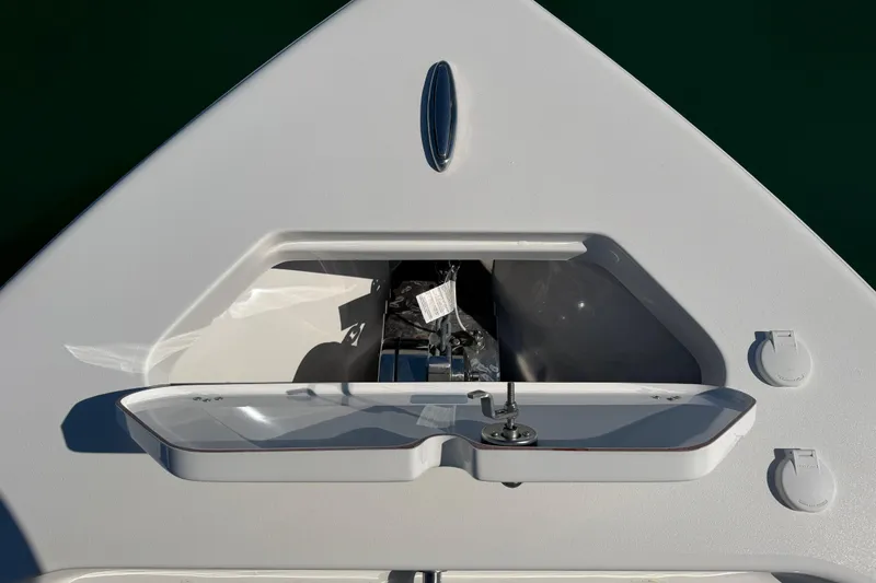 Slide: The Image of 2024 Sea Pro 240 Dual Console boat deck with storage compartment and fittings. - 20