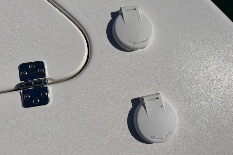 Slide: The Image of Close-up of 2024 Sea Pro 240 Dual Console boat deck with two access hatches. - 21