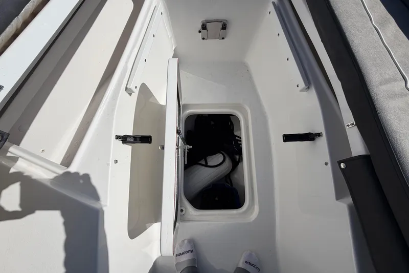 Slide: The Image of Open storage compartment on 2024 Sea Pro 240 Dual Console boat. - 25