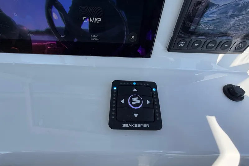 Slide: The Image of Control panel on 2024 Sea Pro 240 Dual Console boat dashboard with Seakeeper system. - 36