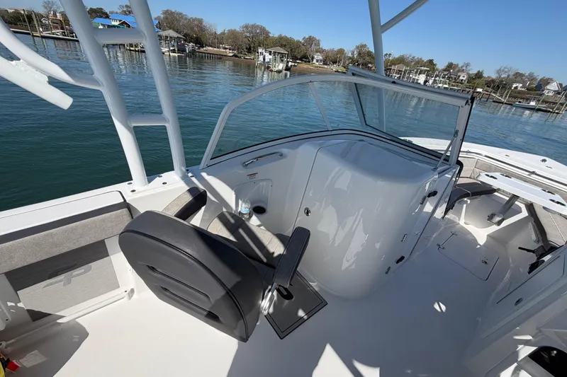 Slide: The Image of 2024 Sea Pro 240 Dual Console boat interior with seating and water view. - 43