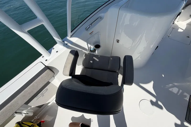 Slide: The Image of 2024 Sea Pro 240 Dual Console boat interior with seating and console details. - 44