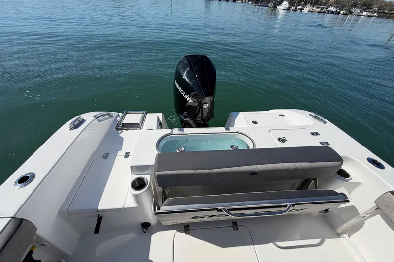 Slide: The Image of 2024 Sea Pro 240 Dual Console boat with Mercury engine on calm water. - 46