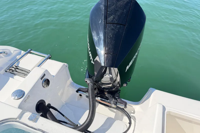 Slide: The Image of 2024 Sea Pro 240 Dual Console boat with Mercury outboard engine on water. - 54