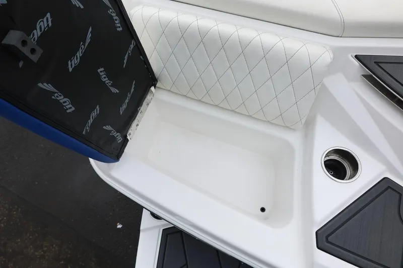 Slide: The Image of 2023 Tigé Z3 boat interior with white quilted seating and cup holder. - 18