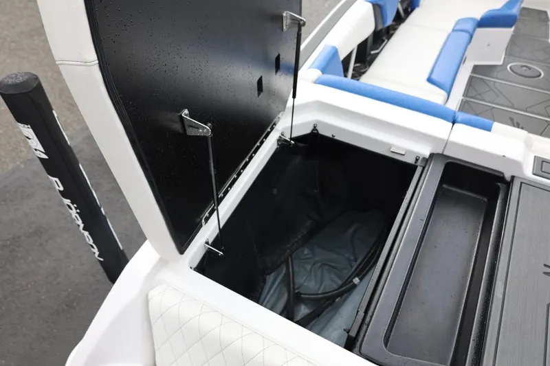 Slide: The Image of 2023 Tigé Z3 boat storage compartment with open lid, showcasing interior space. - 21