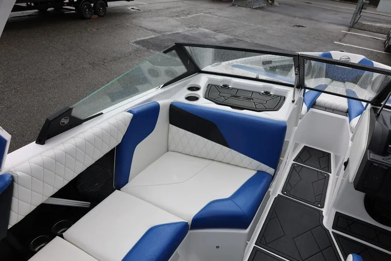 Slide: The Image of 2023 Tigé Z3 boat interior with blue and white seating, modern design. - 27
