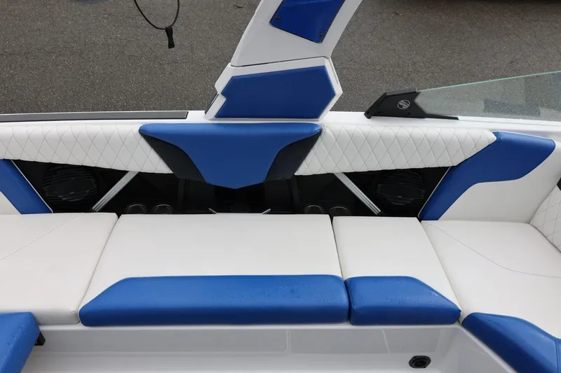 Slide: The Image of 2023 Tigé Z3 boat interior with blue and white seating design. - 28