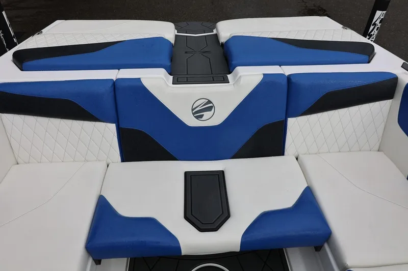 Slide: The Image of 2023 Tigé Z3 boat interior with blue and white cushioned seating. - 30