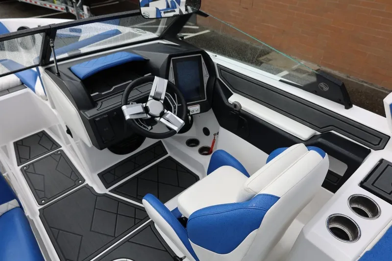 Slide: The Image of 2023 Tigé Z3 boat interior with modern dashboard and blue-white seating. - 32