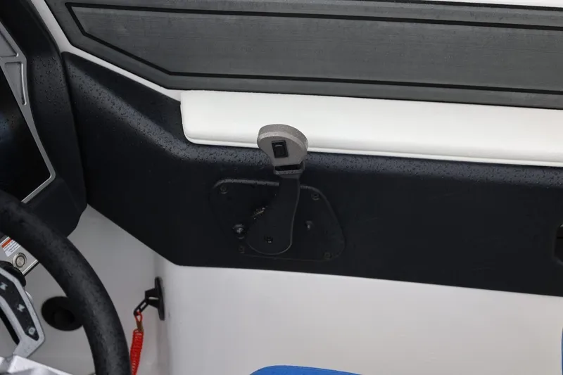 Slide: The Image of Interior view of 2023 Tigé Z3 boat dashboard with steering wheel and control panel. - 34