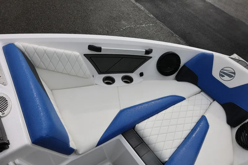 Slide: The Image of 2023 Tigé Z3 boat interior with blue and white cushioned seating and speakers. - 37