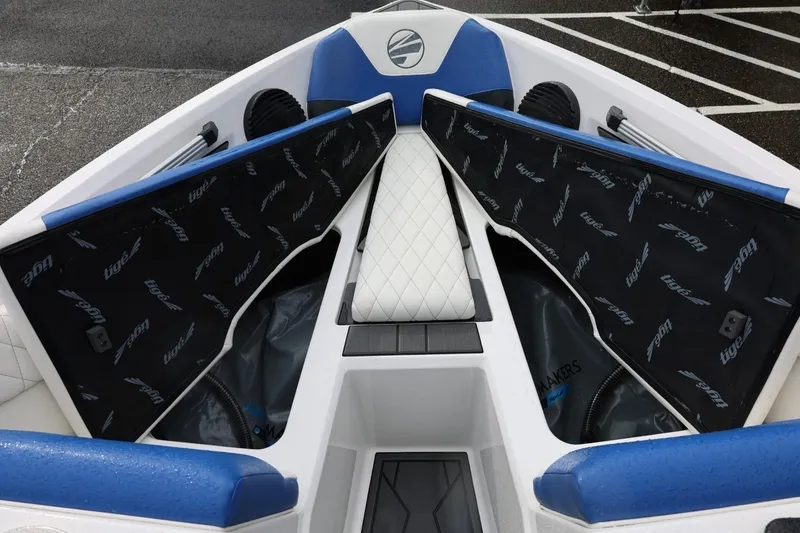 Slide: The Image of 2023 Tigé Z3 boat interior with open storage compartments and blue accents. - 39