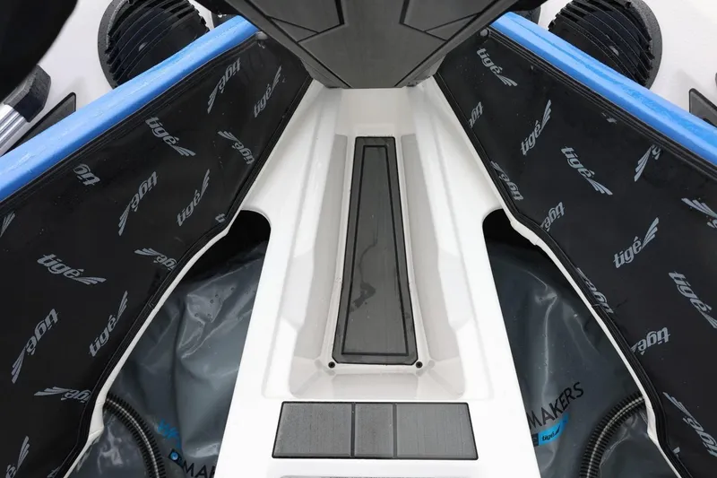 Slide: The Image of 2023 Tigé Z3 boat interior with branded padding and storage compartment. - 40