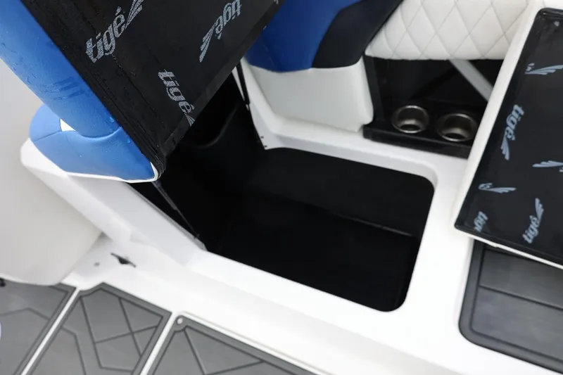 Slide: The Image of 2023 Tigé Z3 boat interior with blue seating and storage compartment. - 45