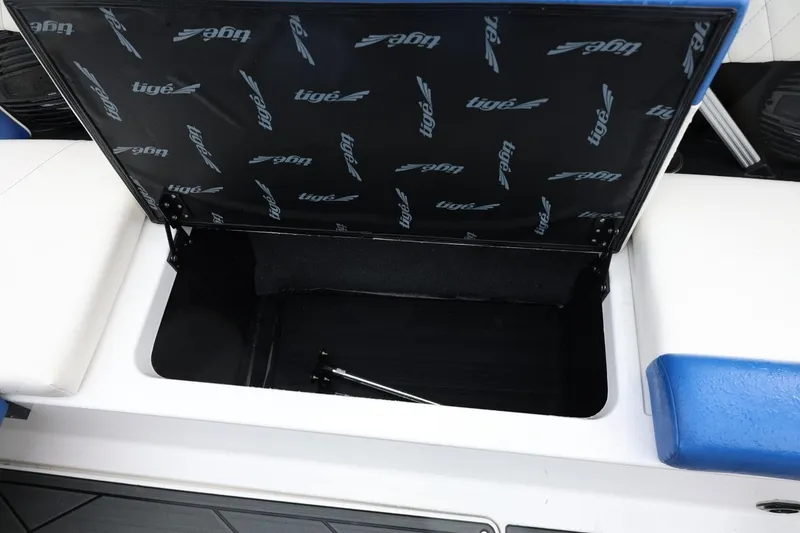 Slide: The Image of Open storage compartment in 2023 Tigé Z3 boat with branded interior lid. - 47