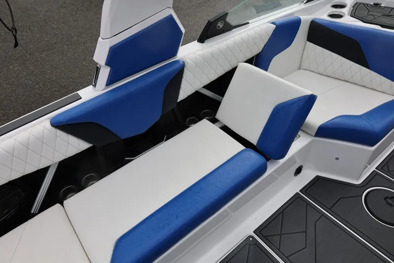 Slide: The Image of 2023 Tigé Z3 boat interior with blue and white seating, featuring modern design. - 49