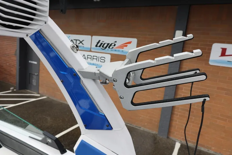 Slide: The Image of 2023 Tigé Z3 boat with wakeboard rack and speaker, displayed outdoors. - 54