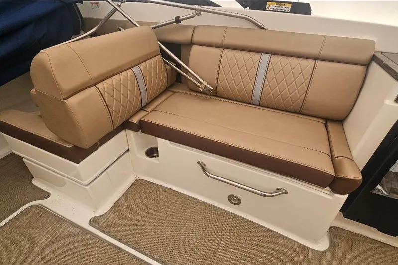 Slide: The Image of 2017 Sea Ray SDX 290 Outboard boat interior with tan leather seating. - 16