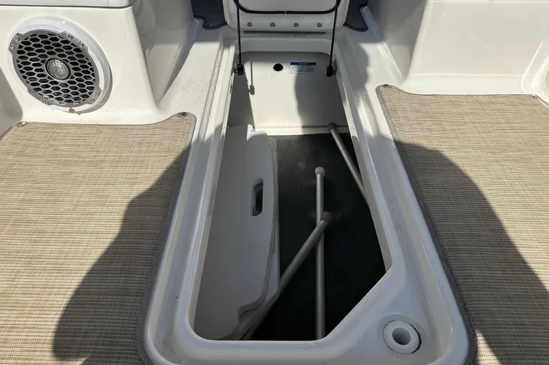 Slide: The Image of Storage compartment on a 2017 Sea Ray SDX 290 Outboard boat, featuring a speaker. - 19