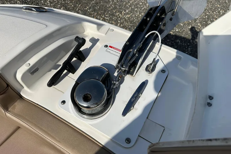 Slide: The Image of Close-up of 2017 Sea Ray SDX 290 Outboard boat anchor winch and cleat. - 26