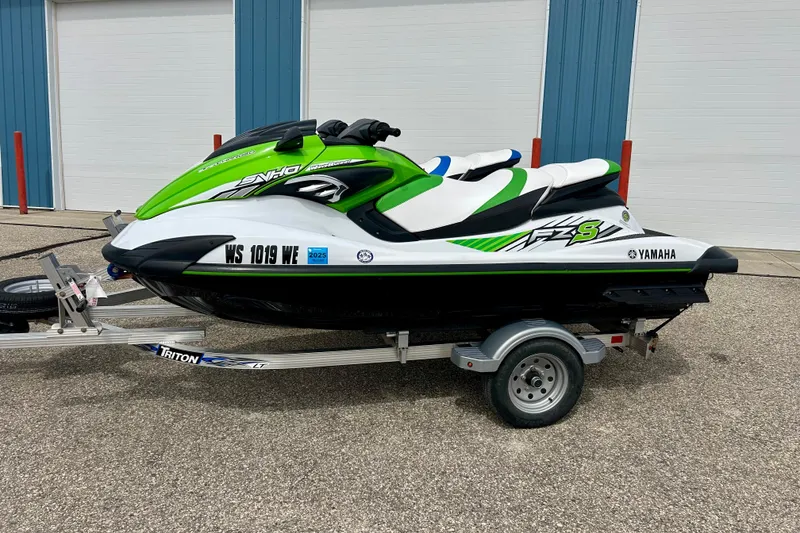 Slide: The Image of 2016 Yamaha WaveRunner FZS in green and white on a trailer. - 18