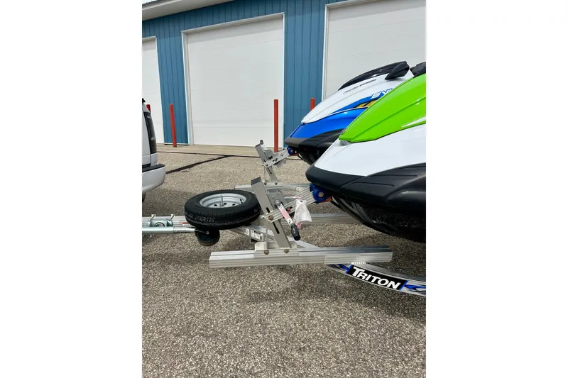 Slide: The Image of 2016 Yamaha WaveRunner FZS on Triton trailer, parked near blue building. - 19