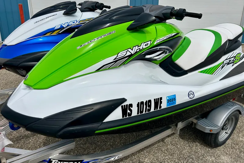 Slide: The Image of 2016 Yamaha WaveRunner FZS in green and white on a trailer. - 22