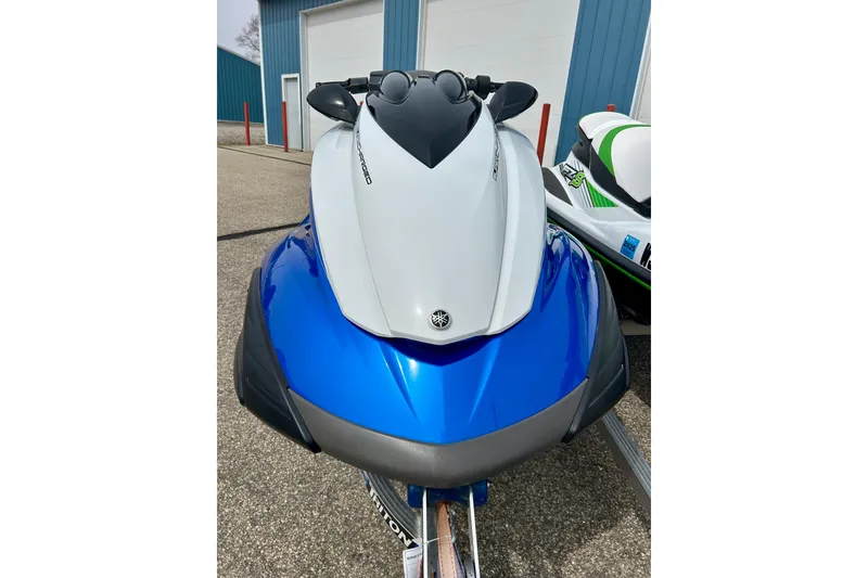Slide: The Image of 2016 Yamaha WaveRunner FZS in blue and white, parked outdoors. - 3