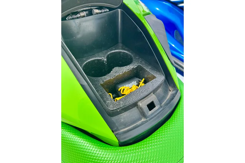 Slide: The Image of 2016 Yamaha WaveRunner FZS storage compartment with cup holders and accessories. - 30
