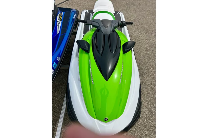Slide: The Image of 2016 Yamaha WaveRunner FZS in vibrant green and white, parked on pavement. - 36