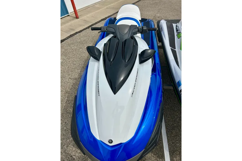 Slide: The Image of 2016 Yamaha WaveRunner FZS in blue and white, parked on pavement. - 37