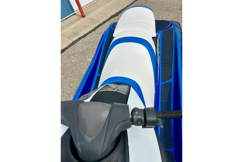 Slide: The Image of 2016 Yamaha WaveRunner FZS with blue and white seat, parked on pavement. - 38