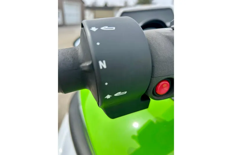 Slide: The Image of Close-up of 2016 Yamaha WaveRunner FZS handlebar controls with green body. - 42