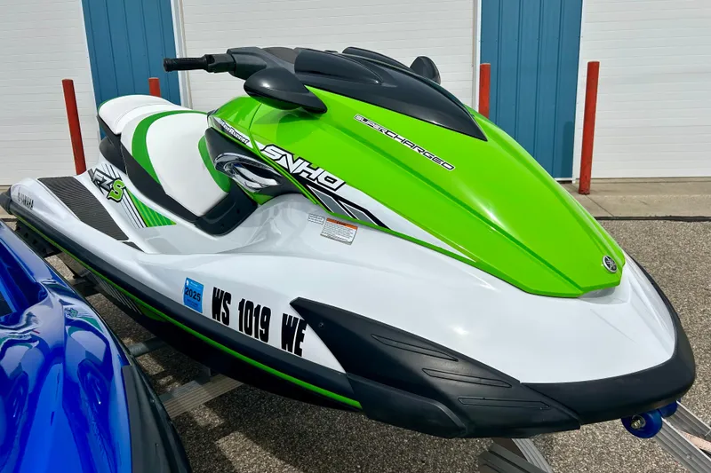 Slide: The Image of 2016 Yamaha WaveRunner FZS in vibrant green and white, parked outdoors. - 9