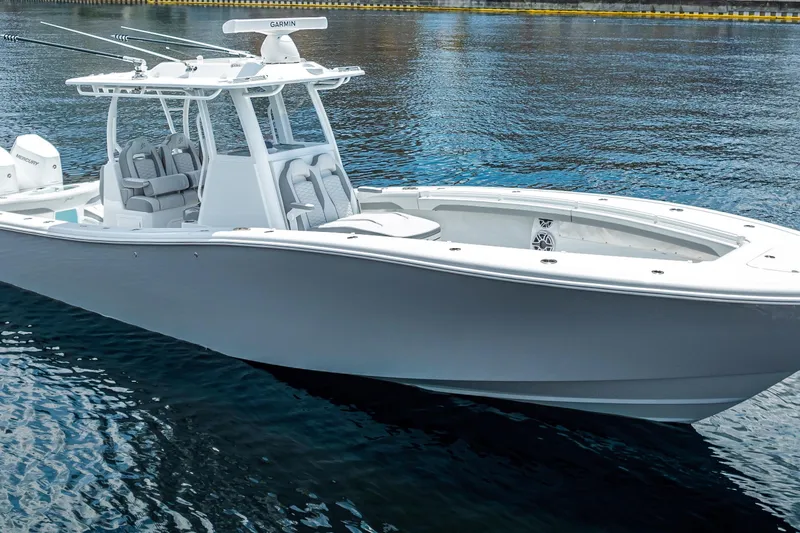 Slide: The Image of 2025 Yellowfin 36 Offshore boat on calm water, showcasing sleek design and modern features. - 0