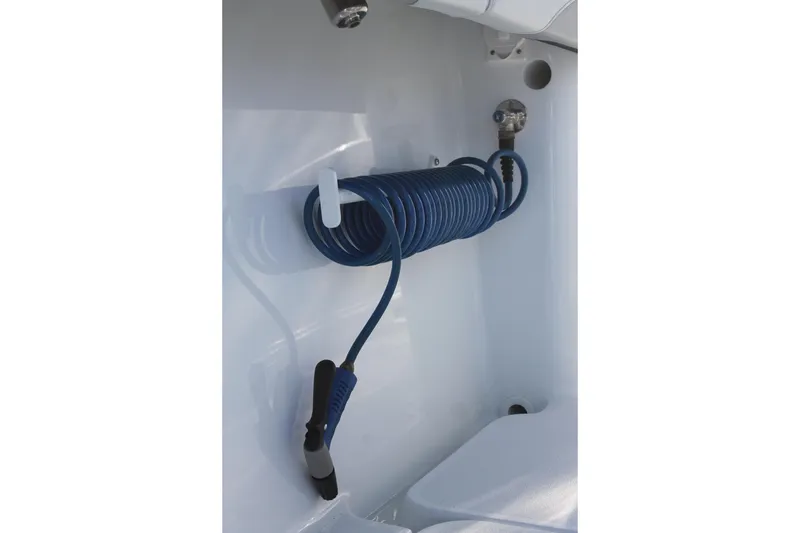 Slide: The Image of Coiled blue hose on 2025 Yellowfin 36 Offshore boat deck. - 10