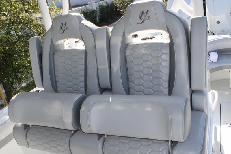 Slide: The Image of 2025 Yellowfin 36 Offshore boat seats with hexagonal pattern and logo embroidery. - 17