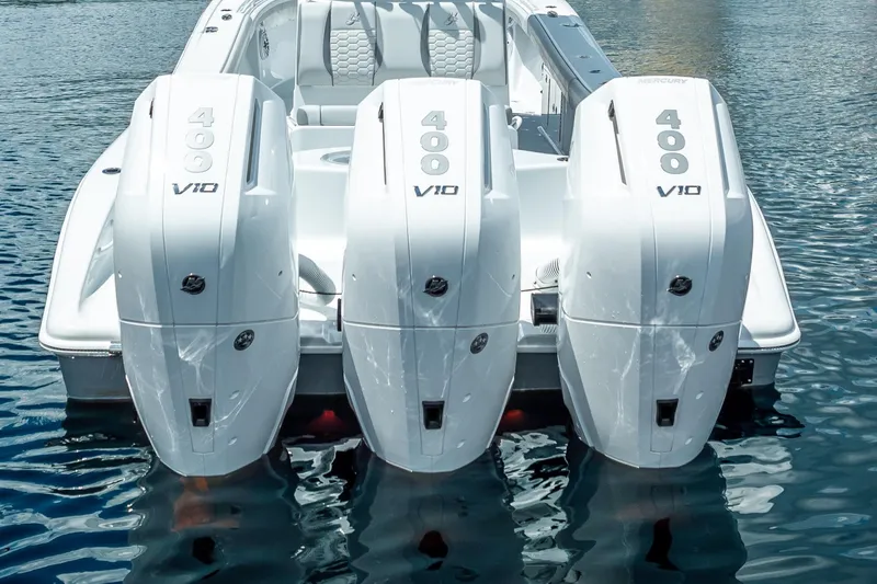 Slide: The Image of 2025 Yellowfin 36 Offshore boat with triple Mercury 400 V10 engines on water. - 19