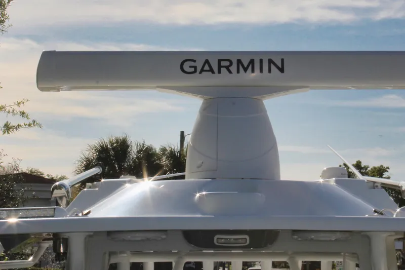 Slide: The Image of 2025 Yellowfin 36 Offshore boat with Garmin radar against a clear sky. - 20